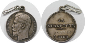 Russische Münzen und Medaillen, Nikolaus II. (1894-1918). Tapferkeitsmedaillen. 4. Klasse. Silber. Patiniert, mit orig. Lochöse und Bandring aus Draht...