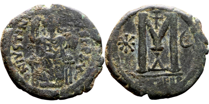 Justinian I (527-565) Follis. Antioch . Obverse: Justinian on throne. Reverse: L...