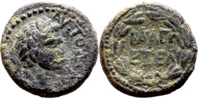 Elagabalus (218-222) bronze coin. Obverse: Bust of Emperor. Reverse: Wreath inscription

15mm 2.68g