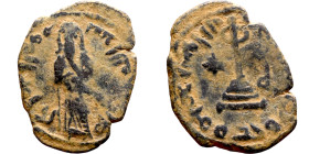al-Malik ibn Marwan (687-705) Follis. Obverse: Imperial figure. Reverse: Modified cross potent set on steps

18mm 2.68g