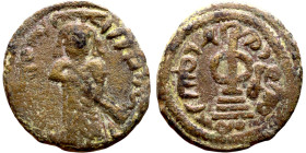 al-Malik ibn Marwan (687-705) Follis. Obverse: Imperial figure. Reverse: Modified cross potent set on steps

18mm 2.69g