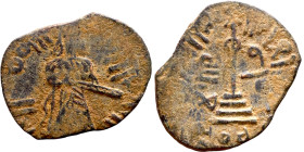 al-Malik ibn Marwan (687-705) Follis. Obverse: Imperial figure. Reverse: Modified cross potent set on steps

18mm 1.17g