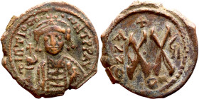 Maurice Tiberius (582-602) Half Follis. Antioch. Obverse: Crowned bust facing, wearing consular robes, holding mappa and eagle-tipped scepte Reverse: ...