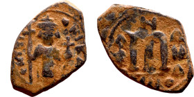 Constans II (641-668) Follis. Obverse: Imperial figure holding cross and globus Reverse: m and inscription

19mm 4.22g