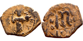Constans II (641-668) Follis. Obverse: Imperial figure holding cross and globus Reverse: m and inscription

26mm 4.36g