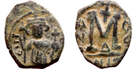 Constans II (641-668) Follis. Obverse: Imperial figure holding cross and globus Reverse: m and inscription

19mm 4.48g