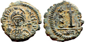 Justinian I (527-565) Decanummium Obverse: D N IVSTINIANVS P P AVG, diademed, helmeted, and cuirassed facing bust holding globus cruciger and shield, ...