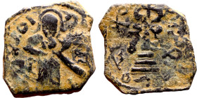 al-Malik ibn Marwan (687-705) Follis. Obverse: Imperial figure. Reverse: Modified cross potent set on steps

18mm 3.80g
