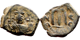 Constans II (641-668) Follis. Obverse: Imperial figure holding cross and globus Reverse: m and inscription

23mm 4.07g