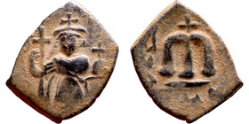Constans II (641-668) Follis. Obverse: Imperial figure holding cross and globus Reverse: m and inscription

22mm 3.83g