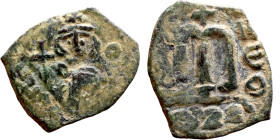 Constans II (641-668) Follis. Obverse: Imperial figure holding cross and globus Reverse: m and inscription

18mm 2.47g