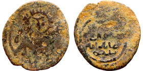 Umayyad/Abbasid. Bronze coin. Obverse: Arbic inscription. Reverse: Arabic inscription

18mm 1.35g