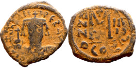 Maurice Tiberius (582-602) Follis. Obverse: Helmeted and cuirassed bust facing, holding globus cruciger and shield., Reverse: Large M above cross, ANN...