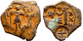 Constans II (641-668) Follis. Obverse: Imperial figure holding cross and globus Reverse: m and inscription

26mm 5.11g

Artificial sand patina