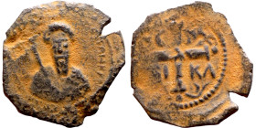 Tancred (Regent: 1101-1103, 1104-1112). Follis. Antioch. Obverse: KE BOIΘH TANKRI.Bust of Tancred facing, wearing turban and chain mail, holding sword...