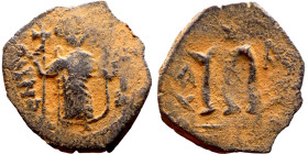 Constans II (641-668) Follis. Obverse: Imperial figure holding cross and globus Reverse: m and inscription

21mm 2.65g

Artificial sand patina