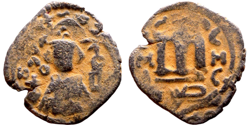 Al-Malik. Follis. Obverse: Imperial figure. Reverse: Modified M

21mm 3.15g
...
