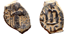 Constans II (641-668) Follis. Obverse: Imperial figure holding cross and globus Reverse: m and inscription

18mm 4.00g