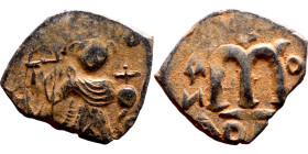 Constans II (641-668) Follis. Obverse: Imperial figure holding cross and globus Reverse: m and inscription

20mm 2.39g