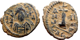 Justinian I (527-565) Decanummium Obverse: D N IVSTINIANVS P P AVG, diademed, helmeted, and cuirassed facing bust holding globus cruciger and shield, ...