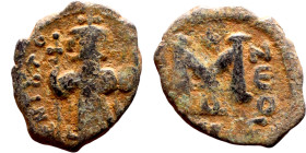 Constans II (641-668) Follis. Obverse: Imperial figure holding cross and globus Reverse: m and inscription

16mm 2.11g