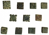 11 ponderales andalusíes en bronce: 10 entre 3,55 g y 4,23 g; 1 de 7,65 g. Algunos con marcas. BC/MBC.