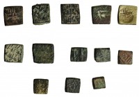 13 ponderales andalusíes en bronce con escritura en anv. y rev. 7 entre 3,80 g. y 3,88 g; 5 entre 1,62 y 194 g. y 1 de 0,90 g. BC/MBC-.