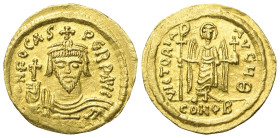 Phocas (602 - 610 n. Chr.).

 Solidus (Gold). Constantinopolis.
Vs: Büste des Kaisers frontal mit Kreuzglobus in der Rechten.
Rs: Frontal stehende...