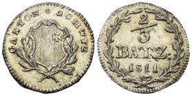 Schweiz. Schwyz - Kanton.

 2/3 Batzen (Silber). 1811.
Vs: Wappen zwischen Zweigen.
Rs: Wertbezeichnung und Jahr in Kranz.

23 mm. 2,12 g. 

H...