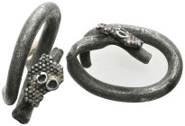 Silver snake ring with gold plating. Roman, 2nd - 3rd century AD. Circumference . Silver wire twisted into a spiral, the ends of which are designed as...