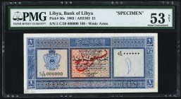 Libya Bank of Libya 1 Pound 1963 Pick 30s Specimen PMG About Uncirculated 53 Net. A pleasing Specimen, and scarce in any grade. Perforated number "109...