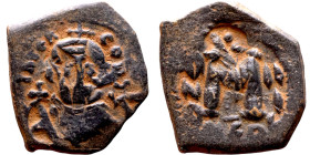 Constans II (641-668) Follis. Obverse: Imperial figure holding cross and globus Reverse: m and inscription

 26mm 6.83g