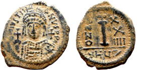 Justinian I (527-565) Decanummium Obverse: D N IVSTINIANVS P P AVG, diademed, helmeted, and cuirassed facing bust holding globus cruciger and shield, ...