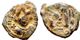 Constans II (641-668) Follis. Obverse: Imperial figure holding cross and globus Reverse: m and inscription

 20mm 5.12g