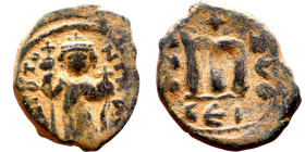 Constans II (641-668) Follis. Obverse: Imperial figure holding cross and globus Reverse: m and inscription

 19mm 6.11g