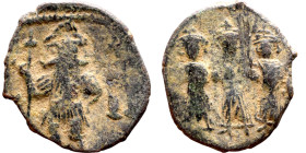 Constans II (641-668) Follis. Obv: Constans, standing facing in plumed helmet and military dress, holding long cross, left hand on hip; regnal year to...