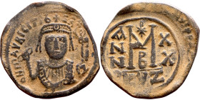 Maurice Tiberius (582-602) Follis. Obverse: Crowned bust facing, wearing consular robes, holding mappa and eagle-tipped scepter , Reverse: Large M cro...