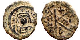 Maurice Tiberius (582-602) Half Follis. Obverse: Helmeted and cuirassed bust facing, holding globus cruciger and shield., Reverse: Large K above cross...