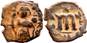 Constans II (641-668) Follis. Obverse: Imperial figure holding globus Reverse: m and inscription

 20mm 4.61g