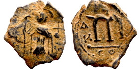 Constans II (641-668) Follis. Obverse: Imperial figure holding globus Reverse: m and inscription

 18mm 2.45g