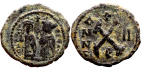 Phocas .(602-610). Decanummium. Obverse: Bust of Phocas and Leonita Reverse: Large X, cross above

 18mm 1.93g