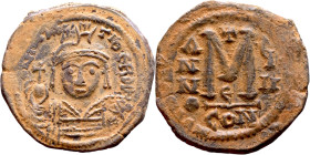 Maurice Tiberius (582-602) Follis. Obverse: Helmeted and cuirassed bust facing, holding globus cruciger and shield., Reverse: Large M above cross, ANN...