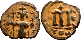 Constans II (641-668) Follis. Obverse: Imperial figure holding globus Reverse: m and inscription

 21mm 2.19g

 Artificial sand patina