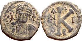 Maurice Tiberius (582-602) Half Follis. Obverse: Helmeted and cuirassed bust facing, holding globus cruciger and shield., Reverse: Large K above cross...