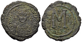 Justinian I (527-565). Æ 40 Nummi (37,3mm, 19.4g). Yera 15 (AD 541/2). Nicomedia. Helmeted and cuirassed bust facing, holding globus cruciger, shield ...