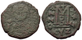 Maurice Tiberius (582-602). Æ (32,4mm, 14g). Cyzicus. Crowned facing bust, wearing consular robes, holding mappa and eagle-tipped scepter surmounted b...