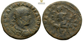 CILICIA, Anazarbus. Valerian I, AD 253-260. 
Obv: Radiate, draped, and cuirassed bust right 
Rev: Male figure, head left, seated right on rock outcrop...