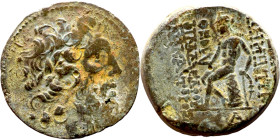 Demetrius II Nicator (Seleukid King: 145-138 BC) bronze Obv: Laureate head of Zeus right Rev: Apollo seated left on omphalos, testing arrow and restin...