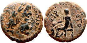 Hellenistic period coin (4-1 century BC) AE Bronze. Obverse: Bust of Zeus. Reverse: Seated figure