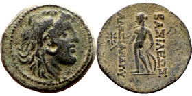 Alexander I Ballas (Seleukid king: 150-145) Bronze. Obv: Head of Alexander I right in lion skin headdress Rev: Apollo standing left, testing arrow and...